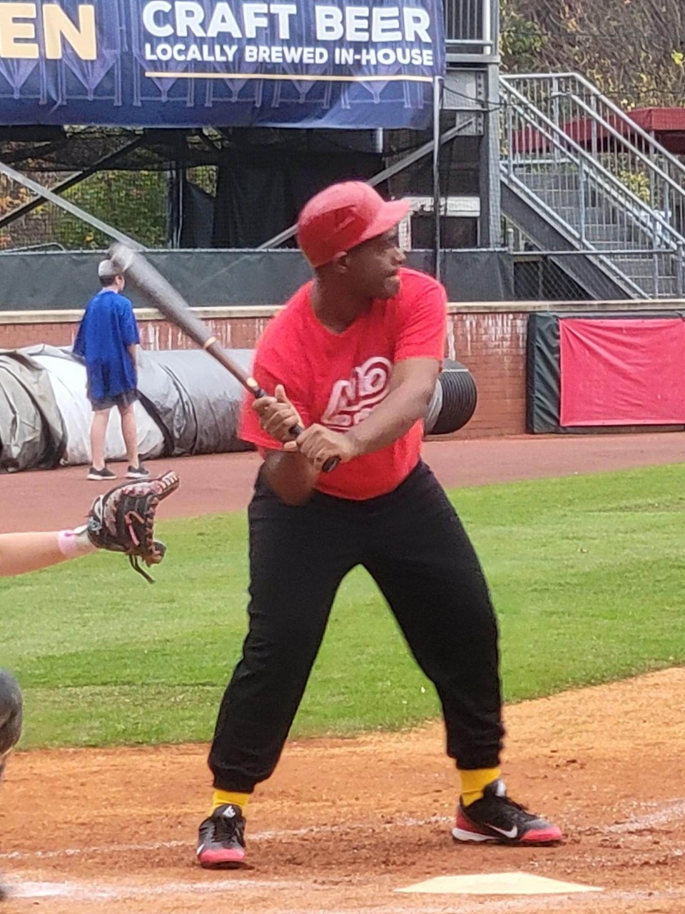 baseball player swinging a bat at home plate