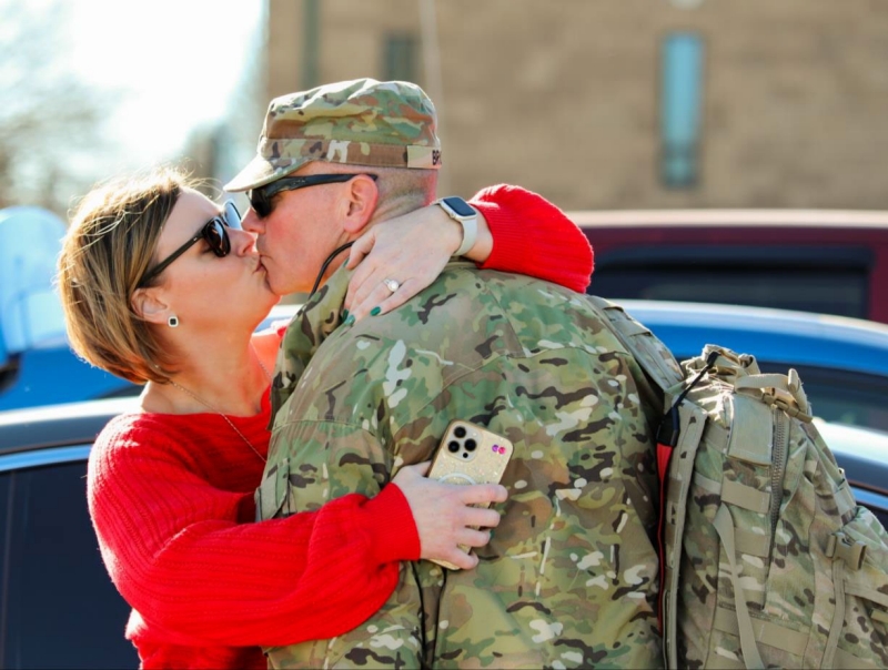 A Tennessee National Guardsman, with the Memphis based 730th Composite Supply Company, embraces a family member, Dec. 14, at Smyrna’s Volunteer Training Site after returning from a successful 10-month deployment overseas. (photo by Cpl. Kalina Hyche)