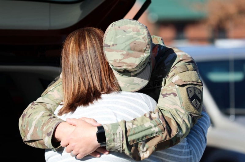 A Tennessee National Guardsman, with the Memphis based 730th Composite Supply Company, embraces a family member, Dec. 14, at Smyrna’s Volunteer Training Site after returning from a successful 10-month deployment overseas. (photo by Cpl. Kalina Hyche)