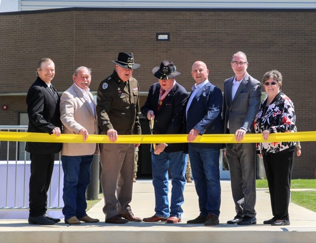 Retired Maj. Gen. Terry “Max” Haston, Tennessee’s 75th Adjutant General, cuts the ribbon to officially open the new Tennessee Army National Guard Readiness Center in Morrison, April 13. The armory was dedicated in honor of Haston's leadership and service while in command. (Photo by Sgt. Kalina Hyche)