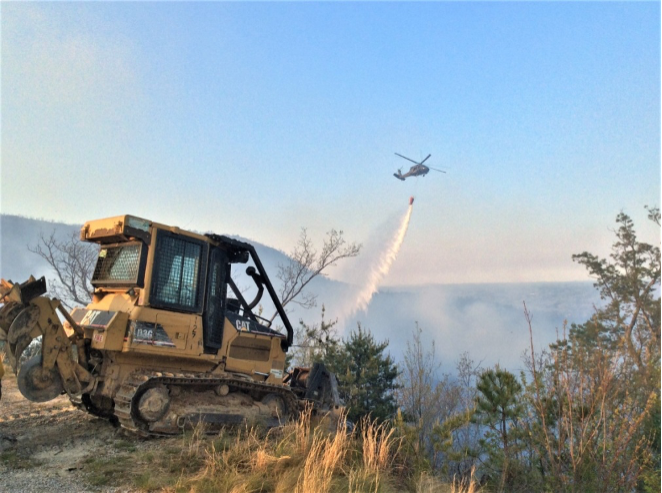 helicopter helping cool fire in advance of dozer